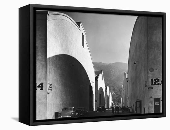 People Walking Between Sound Stages at Warner Brothers Studio-Margaret Bourke-White-Framed Premier Image Canvas