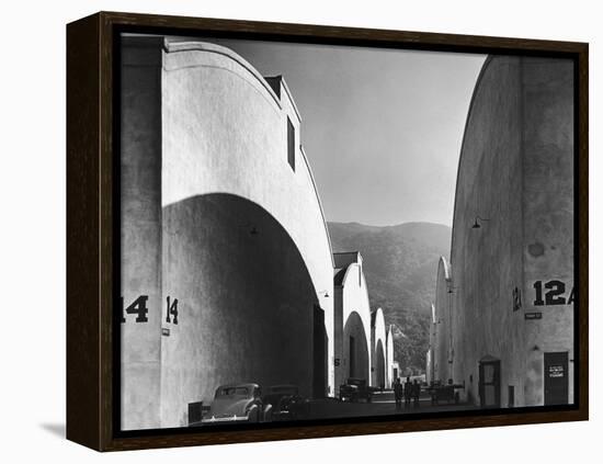 People Walking Between Sound Stages at Warner Brothers Studio-Margaret Bourke-White-Framed Premier Image Canvas