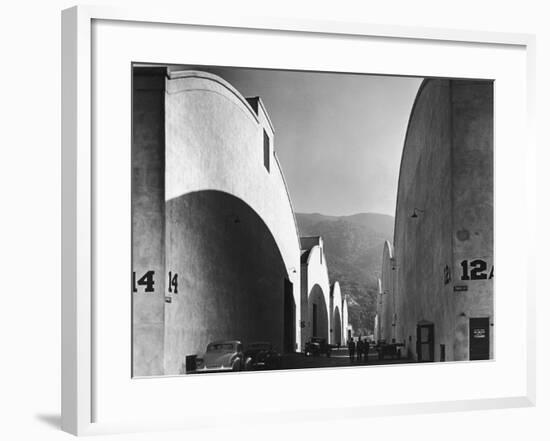 People Walking Between Sound Stages at Warner Brothers Studio-Margaret Bourke-White-Framed Premium Photographic Print