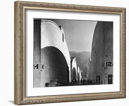 People Walking Between Sound Stages at Warner Brothers Studio-Margaret Bourke-White-Framed Photographic Print