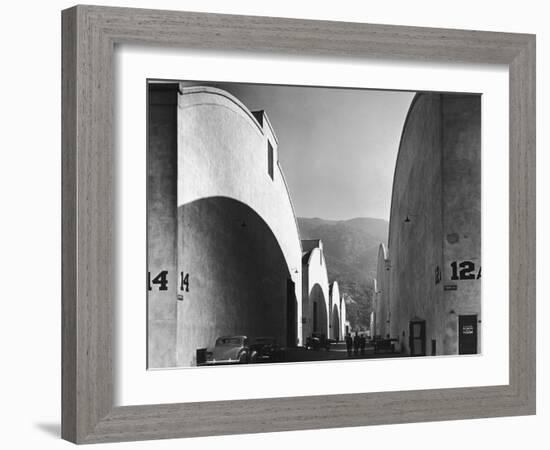 People Walking Between Sound Stages at Warner Brothers Studio-Margaret Bourke-White-Framed Photographic Print