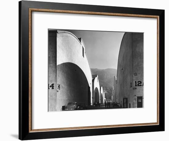 People Walking Between Sound Stages at Warner Brothers Studio-Margaret Bourke-White-Framed Photographic Print