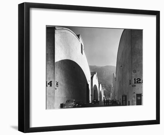 People Walking Between Sound Stages at Warner Brothers Studio-Margaret Bourke-White-Framed Photographic Print