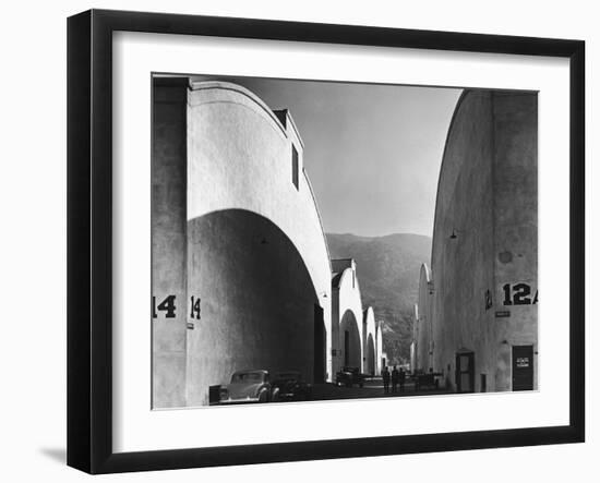 People Walking Between Sound Stages at Warner Brothers Studio-Margaret Bourke-White-Framed Photographic Print