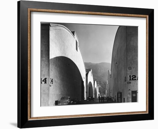 People Walking Between Sound Stages at Warner Brothers Studio-Margaret Bourke-White-Framed Photographic Print