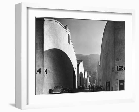 People Walking Between Sound Stages at Warner Brothers Studio-Margaret Bourke-White-Framed Photographic Print