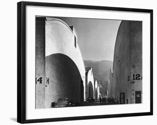 People Walking Between Sound Stages at Warner Brothers Studio-Margaret Bourke-White-Framed Photographic Print