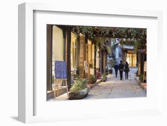 People walking through street, Lijiang, UNESCO World Heritage Site, Yunnan, China, Asia-Ian Trower-Framed Photographic Print