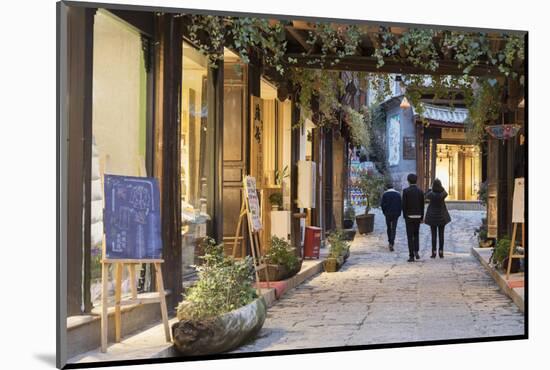 People walking through street, Lijiang, UNESCO World Heritage Site, Yunnan, China, Asia-Ian Trower-Mounted Photographic Print