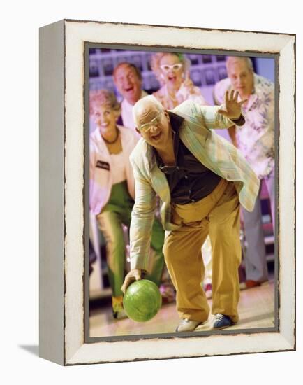 People Watching a Senior Man Bowling at a Bowling Alley-null-Framed Premier Image Canvas