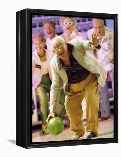 People Watching a Senior Man Bowling at a Bowling Alley-null-Framed Premier Image Canvas