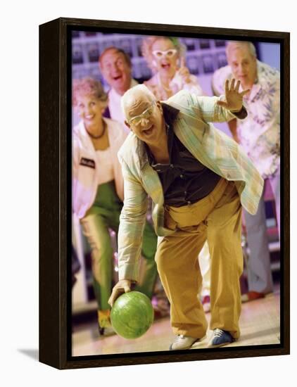 People Watching a Senior Man Bowling at a Bowling Alley-null-Framed Premier Image Canvas