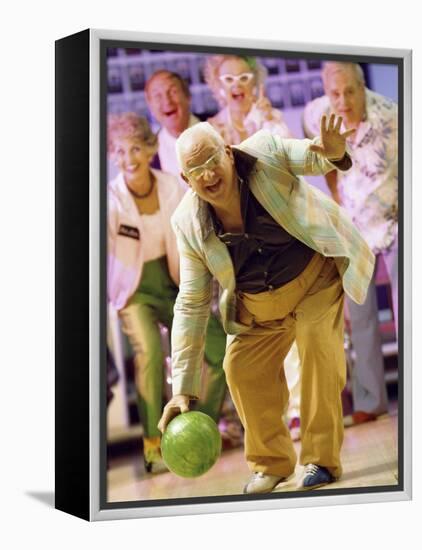 People Watching a Senior Man Bowling at a Bowling Alley-null-Framed Premier Image Canvas