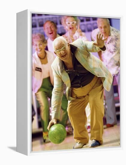 People Watching a Senior Man Bowling at a Bowling Alley-null-Framed Premier Image Canvas