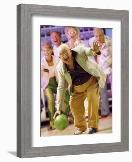 People Watching a Senior Man Bowling at a Bowling Alley-null-Framed Photographic Print