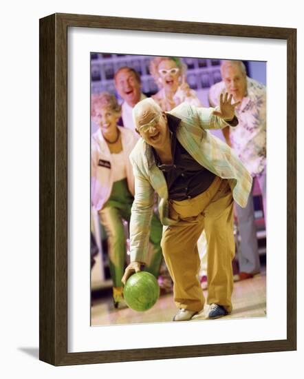People Watching a Senior Man Bowling at a Bowling Alley-null-Framed Photographic Print