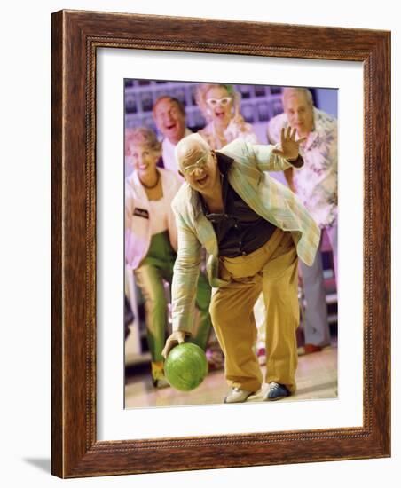 People Watching a Senior Man Bowling at a Bowling Alley-null-Framed Photographic Print