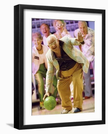 People Watching a Senior Man Bowling at a Bowling Alley-null-Framed Photographic Print