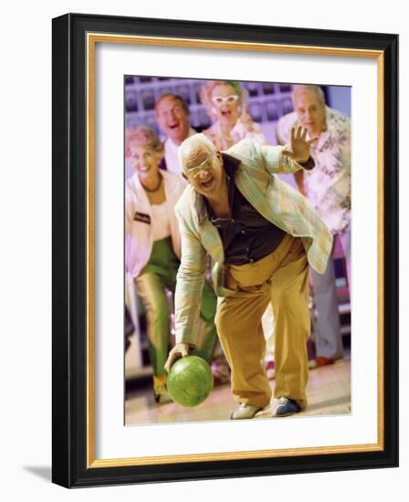 People Watching a Senior Man Bowling at a Bowling Alley-null-Framed Photographic Print