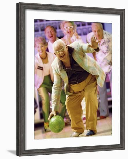 People Watching a Senior Man Bowling at a Bowling Alley-null-Framed Photographic Print