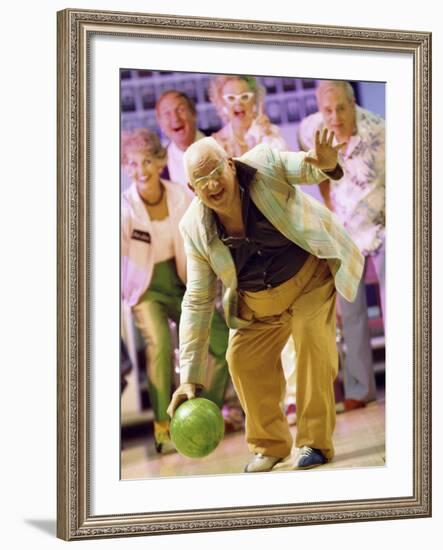 People Watching a Senior Man Bowling at a Bowling Alley-null-Framed Photographic Print