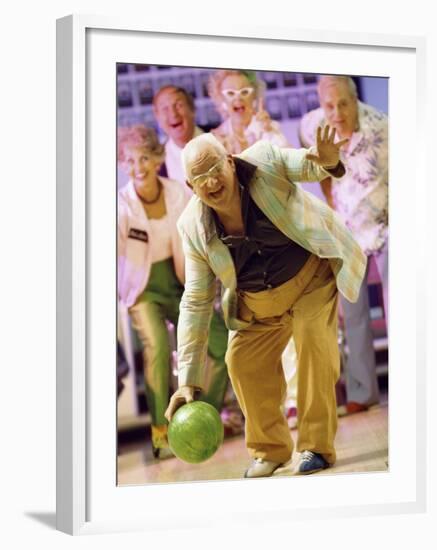 People Watching a Senior Man Bowling at a Bowling Alley-null-Framed Photographic Print