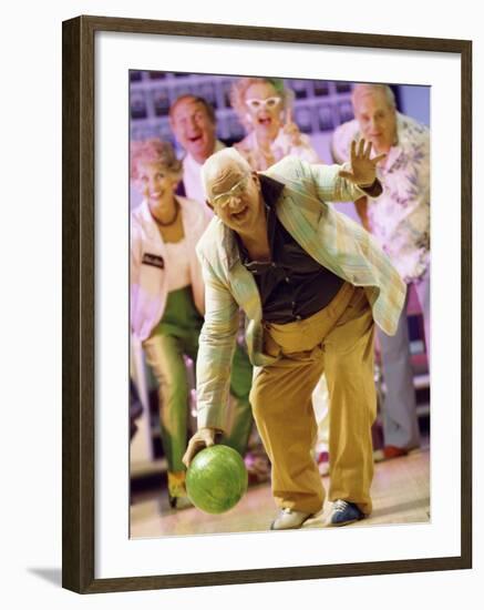 People Watching a Senior Man Bowling at a Bowling Alley-null-Framed Photographic Print