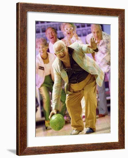 People Watching a Senior Man Bowling at a Bowling Alley-null-Framed Photographic Print