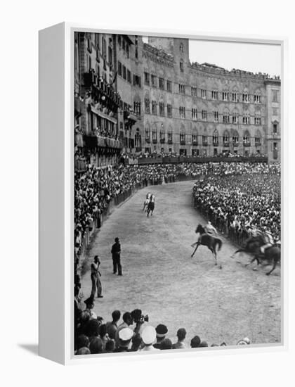 People Watching Horse Race that Is Traditional Part of the Palio Celebration-Walter Sanders-Framed Premier Image Canvas