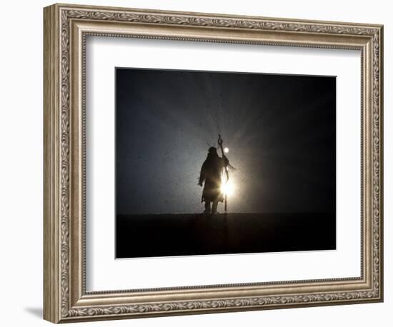 Performer is Silhouetted at the Opening Ceremonies for the XXI Olympic Winter Games in Vancouver-null-Framed Photographic Print