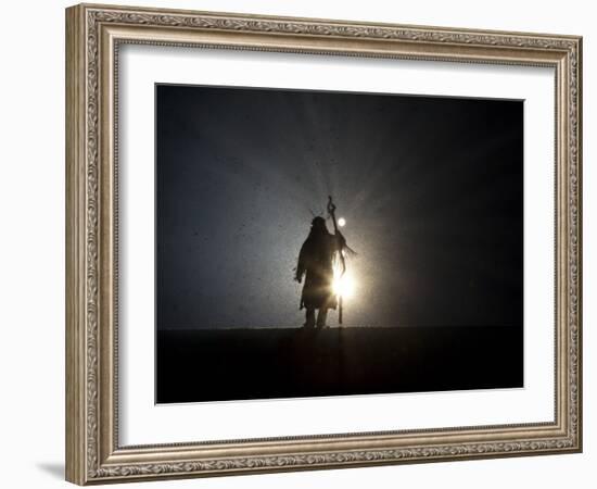 Performer is Silhouetted at the Opening Ceremonies for the XXI Olympic Winter Games in Vancouver-null-Framed Photographic Print