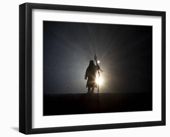 Performer is Silhouetted at the Opening Ceremonies for the XXI Olympic Winter Games in Vancouver-null-Framed Photographic Print
