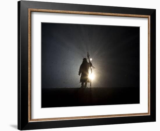 Performer is Silhouetted at the Opening Ceremonies for the XXI Olympic Winter Games in Vancouver--Framed Photographic Print