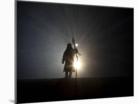 Performer is Silhouetted at the Opening Ceremonies for the XXI Olympic Winter Games in Vancouver-null-Mounted Photographic Print