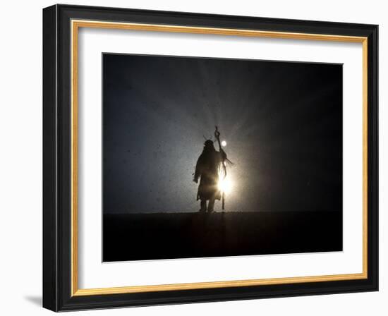 Performer is Silhouetted at the Opening Ceremonies for the XXI Olympic Winter Games in Vancouver-null-Framed Photographic Print