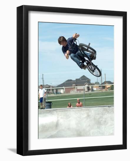 Performing a Bicycle Stunt-null-Framed Photographic Print