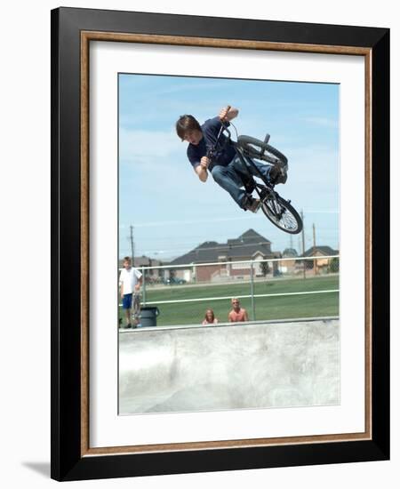 Performing a Bicycle Stunt-null-Framed Photographic Print