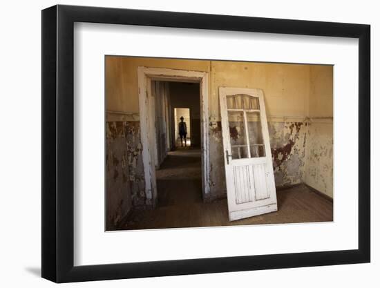 Person in Abandoned House, Kolmanskop Ghost Town, Namibia-David Wall-Framed Photographic Print