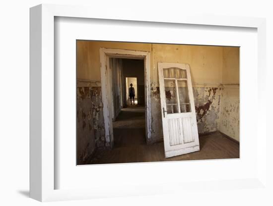 Person in Abandoned House, Kolmanskop Ghost Town, Namibia-David Wall-Framed Photographic Print