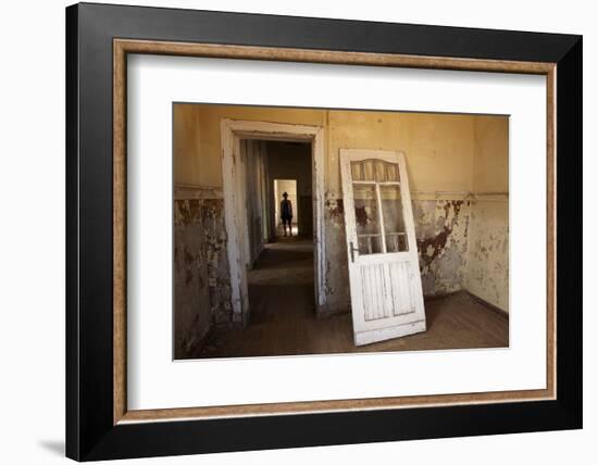 Person in Abandoned House, Kolmanskop Ghost Town, Namibia-David Wall-Framed Premium Photographic Print