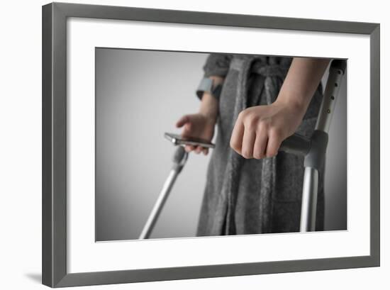 Person on Crutches Texting-Anthony West-Framed Photographic Print