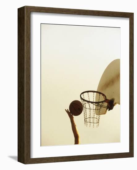 Person's Hand Holding a Basketball Near the Hoop-null-Framed Photographic Print