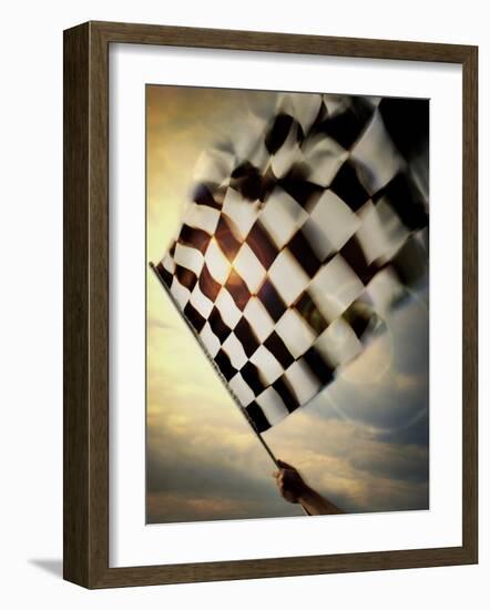 Person's Hand Waving a Checkered Flag--Framed Photographic Print
