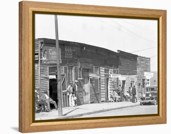 person shop fronts in Vicksburg, Mississippi, 1936-Walker Evans-Framed Premier Image Canvas