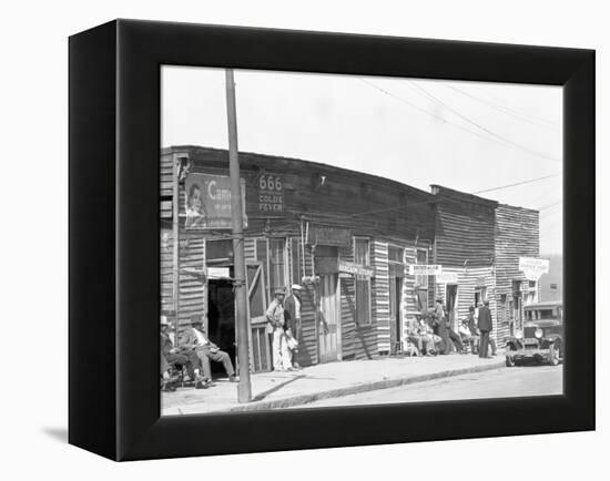 person shop fronts in Vicksburg, Mississippi, 1936-Walker Evans-Framed Premier Image Canvas