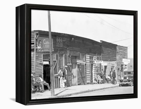 person shop fronts in Vicksburg, Mississippi, 1936-Walker Evans-Framed Premier Image Canvas