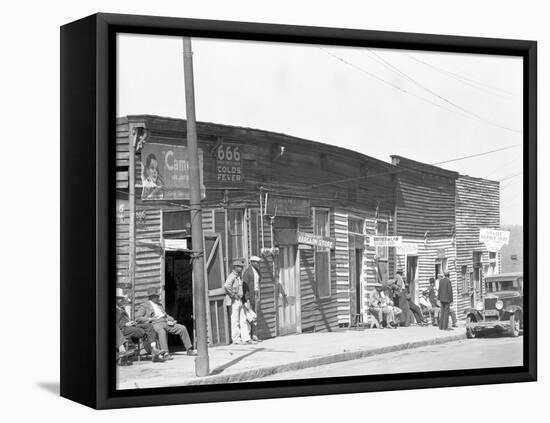 person shop fronts in Vicksburg, Mississippi, 1936-Walker Evans-Framed Premier Image Canvas