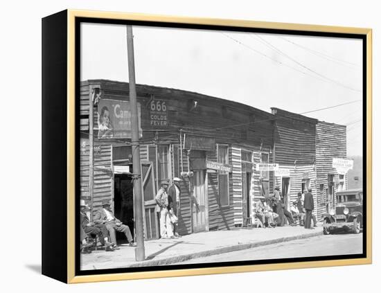 person shop fronts in Vicksburg, Mississippi, 1936-Walker Evans-Framed Premier Image Canvas