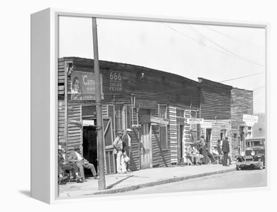 person shop fronts in Vicksburg, Mississippi, 1936-Walker Evans-Framed Premier Image Canvas