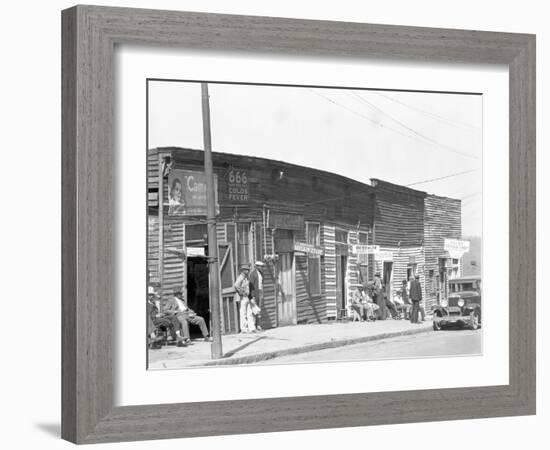 person shop fronts in Vicksburg, Mississippi, 1936-Walker Evans-Framed Photographic Print